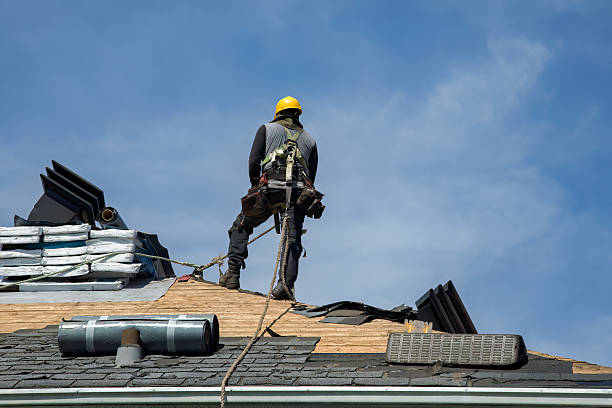 Professional Roofing technician working in Spragueville, IA